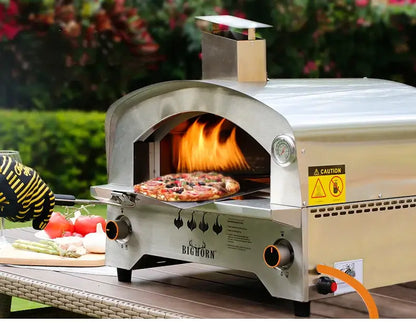 Large gas pizza stove in outdoor setting, featuring flames and fresh pizza, perfect for backyard cooking.