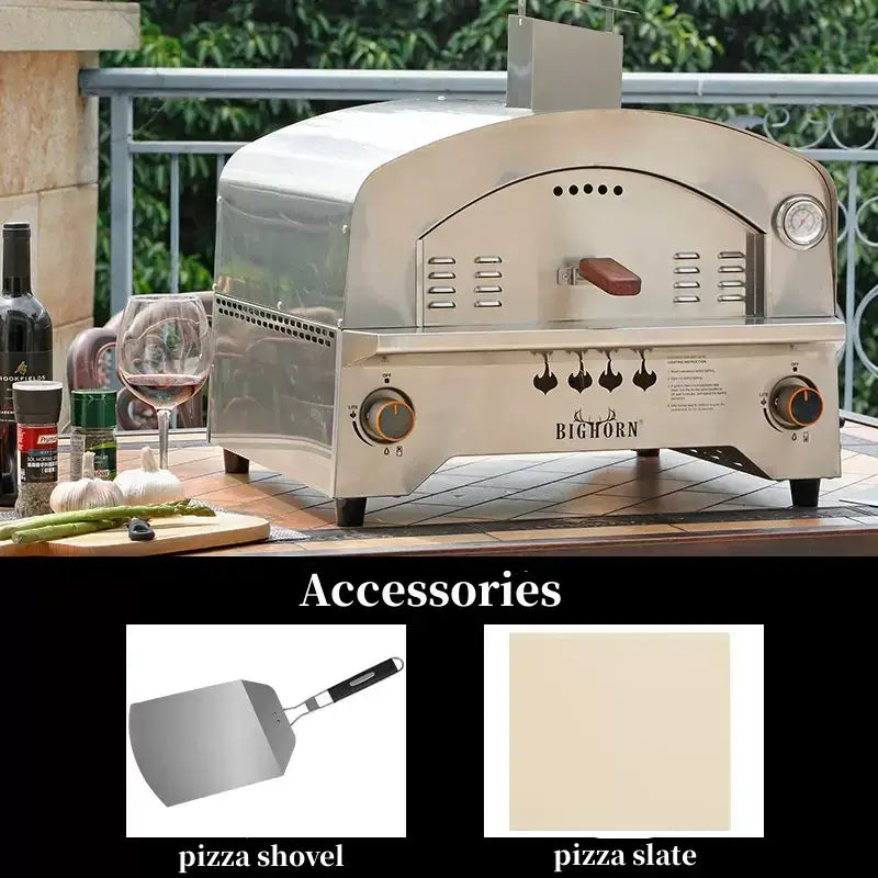 Large gas pizza oven with accessories including a pizza shovel and pizza slate on a stylish outdoor table setting.