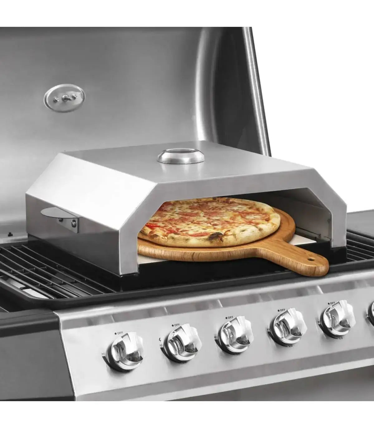 Ceramic stone pizza oven on a grill with a freshly baked pizza, perfect for outdoor gatherings and portable cooking.